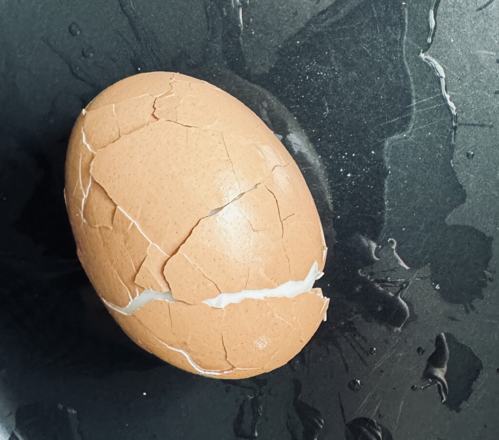 cracked egg ready for peeling