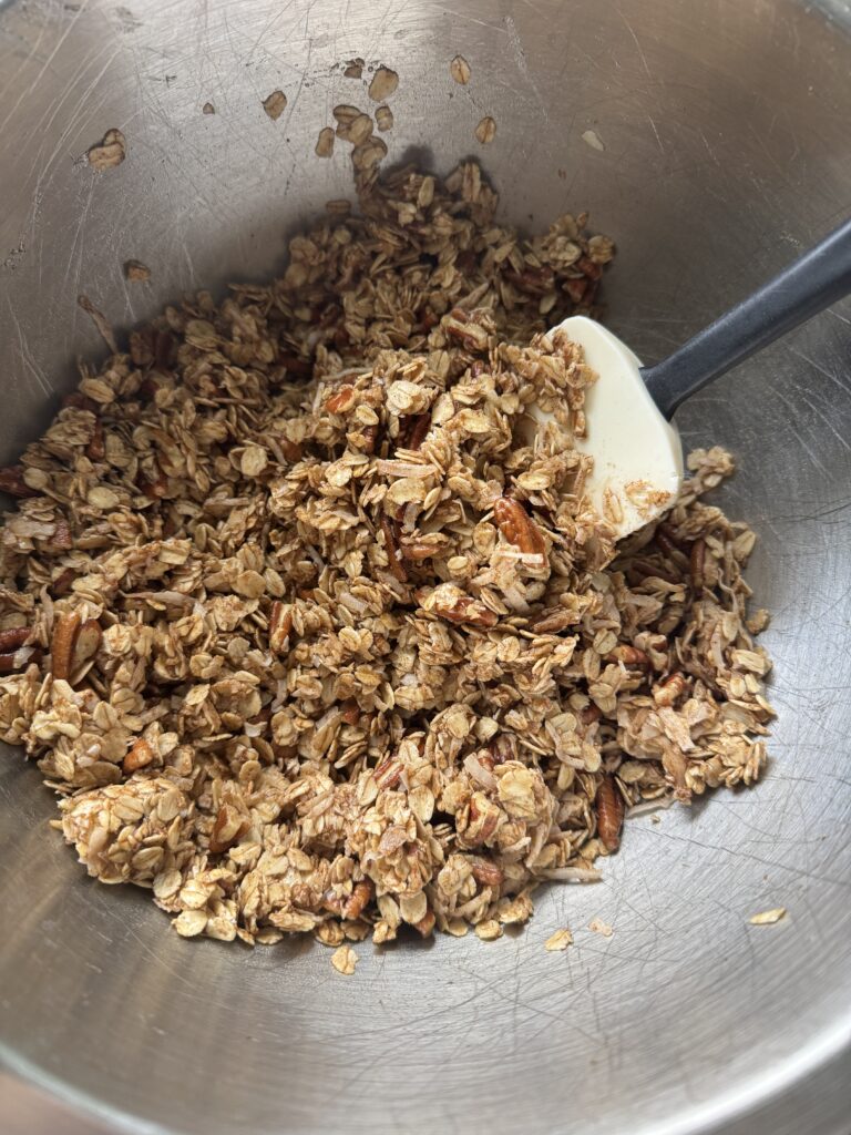 Easy Cinnamon Coconut Pecan Granola. So simple just mix all of the ingredients together, bake, and enjoy!